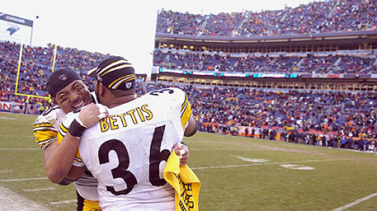 Two of the most dominant and beloved of the modern Steelers, Hines Ward and Jerome Bettis, were 1990s draft day acquisitions. Bettis came via a 1996 trade with the Los Angeles Rams; Ward was the ultimate sleeper pick, taken in the third round in 1998. Here Ward congratulates Bettis after beating the Broncos for the AFC championship in January 2006, securing a Super Bowl bid in Bettis's hometown of Detroit.