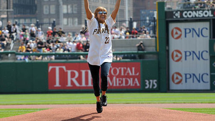 Ali McMutrie of Ben Avon Heights throws out the first pitch at the Pirates season opener against the Dodgers at PNC Park, Monday. McMutrie and her sister Jamie brought a number of orphans from earthquake-ravaged Haiti earlier this year.