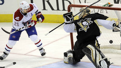 Canadians forward Brian Gionta scores his team's fifth goal beating Penguins goaltender Brent Johnson in the third period of Wednesday's game at Mellon Arena.