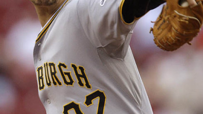 Pirates starting pitcher Charlie Morton throws against in the first inning.