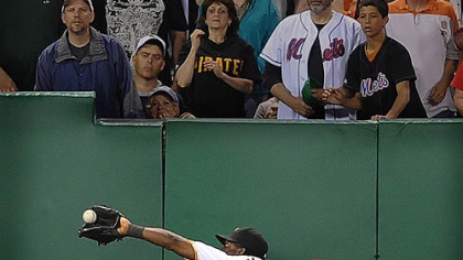 Left fielder Lastings Milledge makes the game-ending catch on a line drive by San Francisco's Freddy Sanchez. The Giants had bases loaded.
