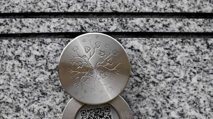 A Memory Medallion on a gravestone.