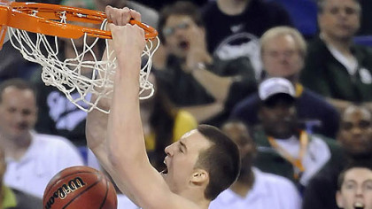 Duke's Miles Plumlee dunks the ball in front of West Virginia's Wellington Smith in the second half of the semifinal game in the NCAA tournament in Indianapolis last night.