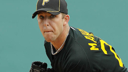 Pirates pitcher Paul Maholm warms up in the first inning.