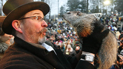 Punxsutawney Phil is held by Ben Hughes after emerging this morning from his burrow on Gobblers Knob in Punxsutawney. Phil saw his shadow and forecast six more weeks of winter weather.
