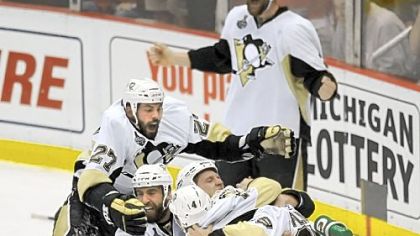 Players dogpile after defeating Detroit for the Stanley Cup in June 2009. The Penguins meet the Red Wings again today in Detroit, but the goal this time is a win to cling to an Atlantic Division lead.