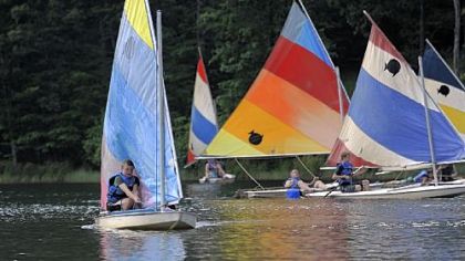 Jacob Ford, 13, of Troop 1404 in California, Pa., earlier this month works to control a Sunfish sailboat on Lake Courage during the Greater Pittsburgh Council Heritage Reservation Boy Scout camp near Farmington, Fayette County.