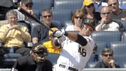 The Pirates' Garrett Jones follows the flight of his two-run home run off Los Angeles Dodgers starting pitcher Vicente Padilla in the first inning of the Opening Day baseball game at PNC Park, Monday.