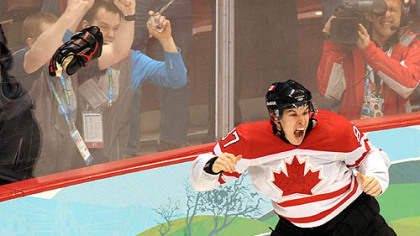 Sidney Crosby  jubilates after scoring the gold medal-winning goal for Canada at the Winter Olympic Games in Vancouver last month. Crosby's glove, left, and his stick and other glove had gone missing after the game, but were found to be misplaced, not stolen.