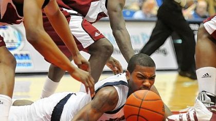 Duquesnes guard B.J. Monteiro dives for the loose ball during last night's game against Massachusetts at the A.J. Palumbo Center.