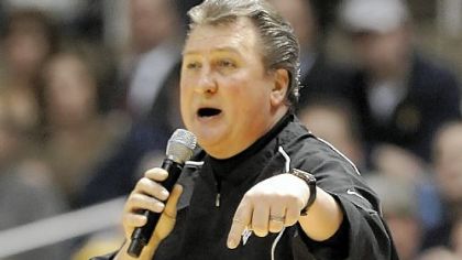 West Virginia head coach Bob Huggins addresses the crowd during the second half of Wednesday's game against Pitt. The game was interrupted twice when fans threw debris on the court.