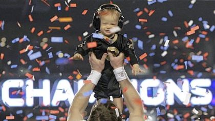 Drew Brees celebrates New Orleans' first Super Bowl win with his son Baylen.
