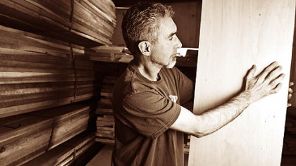 At the Gat Creek Caperton Furniture Works in Berkeley Springs, W.Va., Robert Fitz selects cherry lumber for a table.