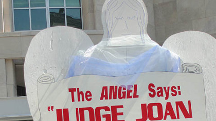 As he promised, Harrisburg citizen activist Gene Stilp erected a 15-foot-high plywood statue of an angel outside the Pennsylvania Judicial Center, urging state Supreme Court Justice Joan Orie Melvin to resign.