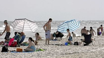Beach-goers flock on Saturday to Gulf Shores, Ala., where tourism has picked up since BP stopped the flow of oil into the Gulf of Mexico.