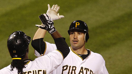 The Pirates' Neil Walker celebrates with Andrew McCutchen after hitting a two-run homer, his first homer in the majors, off Cubs pitcher Ted Lilly in the eighth inning.