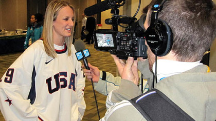Brianne McLaughlin speaks with a Quebec television crew Thursday at the Main Press Center.