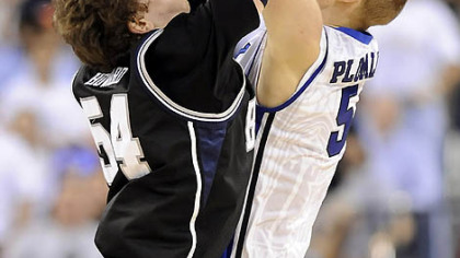 Butler's Matt Howard goes for a rebound against Duke's Mason Plumlee in the first half.