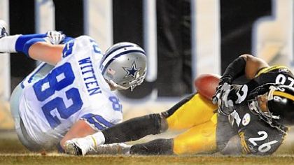Steelers Deshea Townsend dives in to the end zone and scores after he intercepts a pass from the Cowboys Tony Romo in the 4th quarter of a frigid 2008 game.