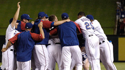The Rangers celebrate after defeating the Pirates, 6-5, Thursday at The Ballpark in Arlington, Texas.