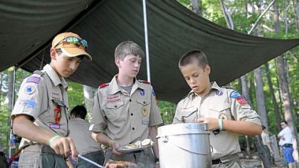 Preparing dinner are, from left, Nick Sisco, 14, Jeremy Hinnebusch, 13, and Eric Stabb, 12, of the Fox Patrol of Troop 329 in McCandless.