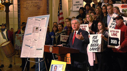 Backed by a crowd made up mostly of Sheetz employees who were being paid to be on hand, State Sen. John Rafferty, R-Montgomery County, speaks out Tuesday about legislation he plans to introduce that will allow supermarkets and convenience stores to sell beer. The senator spoke during a state Capitol Rotunda event sponsored by the Pennsylvania Food Merchants Association and the Pennsylvania Convenience Store Council.