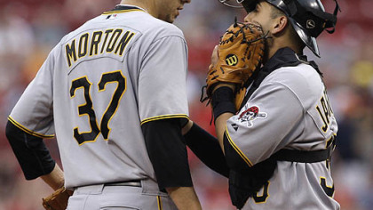 Pirates starting pitcher Charlie Morton talks with catcher Jason Jaramillo in the first inning.