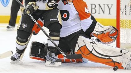 Flyers goalie Michael Leighton stops a shot by Matt Cooke last night at Mellon Arena.