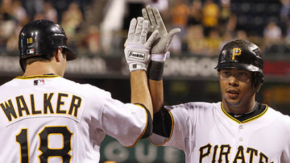The Pirates' Jose Tabata is greeted by Neil Walker after hitting his first major league home run off White Sox pitcher John Danks during the eighth inning.