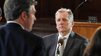 Michael Kenney, executive director of the Pittsburgh Water and Sewer Authority, listens to City Councilman Patrick Dowd, who called for Kenney's resignation.