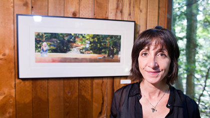 Peggi Nero Habets stands near her watercolor "Forest for the Trees" which won the jurors award.