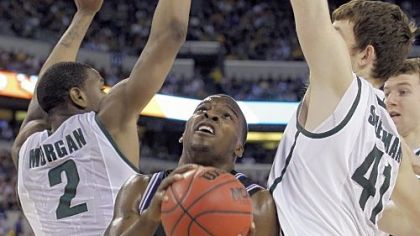 Butler's Shelvin Mack drives between Michigan State's backcourt.