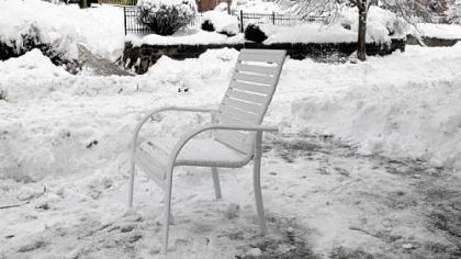 A patio chair saves a shoveled parking space along Pennsylvania Avenue in Manchester.