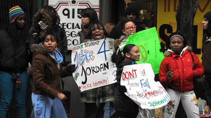 Some of the CAPA students wave their signs at motorists along Liberty Avenue as they marched to the mayor's office and City Council chambers.