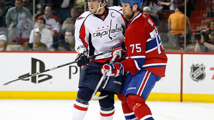 Canadiens defenseman Hal Gill, right, defends Capitals captain Alex Ovechkin during Game 6 of their Eastern Conference quarterfinal series at the Bell Centre, Monday.