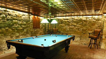 A billiards room inside one of the basement rooms.