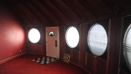 The entryway of the home. The circular windows are featured all around the home.