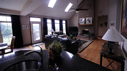 The view of the living room, as seen from the kitchen.