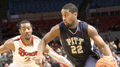 Pitt's Brad Wanamaker (22) drives past St. John's Justin Burrell during the first half of today's game at Madison Square Garden.