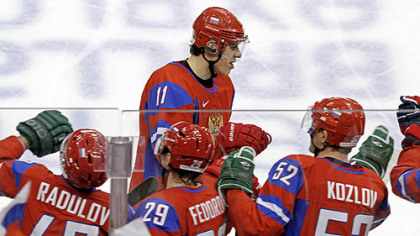 Center Evgeni Malkin is congratulated at the Russian bench after the first of two goals Sunday.