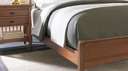 The slat sleigh bed is from Cresent Fine Furniture, which closed its plant in Tennessee and moved production to Vietnam.