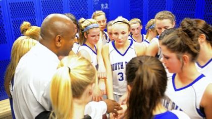South Park coach Reggie Wells says a prayer with his team before taking on Chartiers Valley Jan. 28.