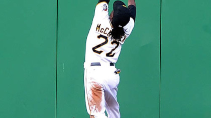 Pirates outfielder Andrew McCutchen leaps for ball hit by the Brewers' Corey Hart for a triple.