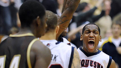 Duquesne's Damian Saunders celebrates the Dukes' 70-69 win vs. St. Bonaventure at the Palumbo Center -- their first A-10 win of the season.