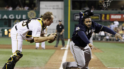 Pirates catcher Erik Kratz tags out the Brewers' Prince Fielder who was attempting to score in the eighth inning on a single to right field by Alcides Escobar.