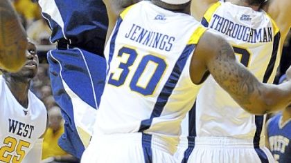 Jermaine Dixon is surrounded by West Virginia defenders, including Dan Jennings and Cam Thoroughman, Wednesday night. Dixon and Pitt found little breathing room, especially late in the second half when the Mountaineers pulled away.