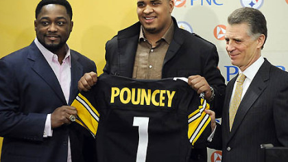 The Steelers' first-round draft pick Maurkice Pouncey poses with head coach Mike Tomlin and president Art Rooney II during a press conference at the team's South Side facilities, earlier this year.