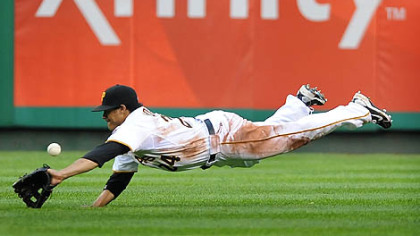Right fielder Delwyn Young stretches out but can't come up with a single by San Francisco's Bengie Molina Saturday night at PNC Park.