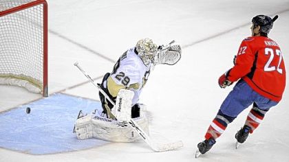 Through this pileup in the Penguins' net, Washington's Mike Knuble scores a goal against Marc-Andre Fleury in the second period Wednesday night in Washington. Jordan Staal tries to stop Knuble, who would later win the game in a shootout.