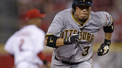 Pirates second baseman Aki Iwamura runs towards third base in the sixth inning.